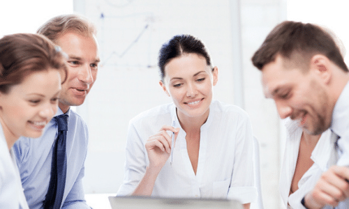 An image of four people in an office settings discussing best small business ideas in Australia this 2021 – Hart Partners